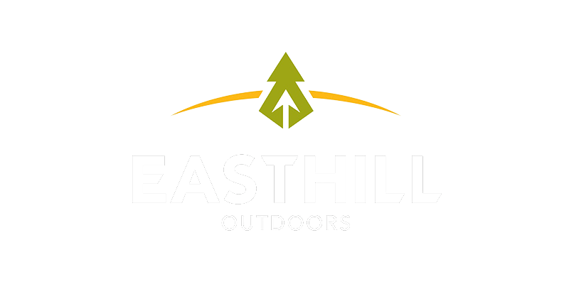 Easthill logo in white with green tree and yellow accent