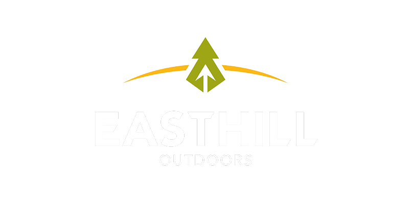 Easthill logo in white with green tree and yellow accent